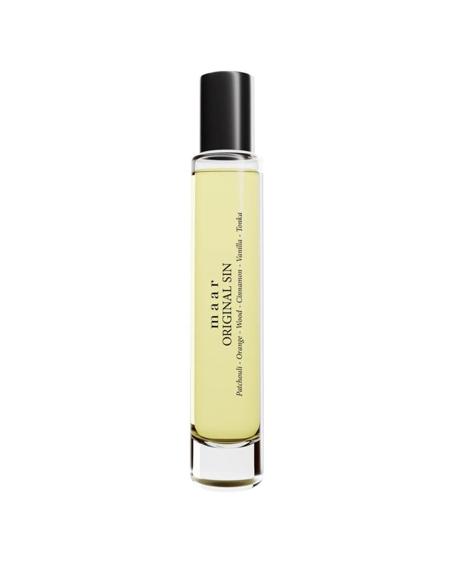 1. Studio shot of maar Original Sin perfume oil in 10ml clear glass bottle with black cap, featuring label text and light yellow liquid