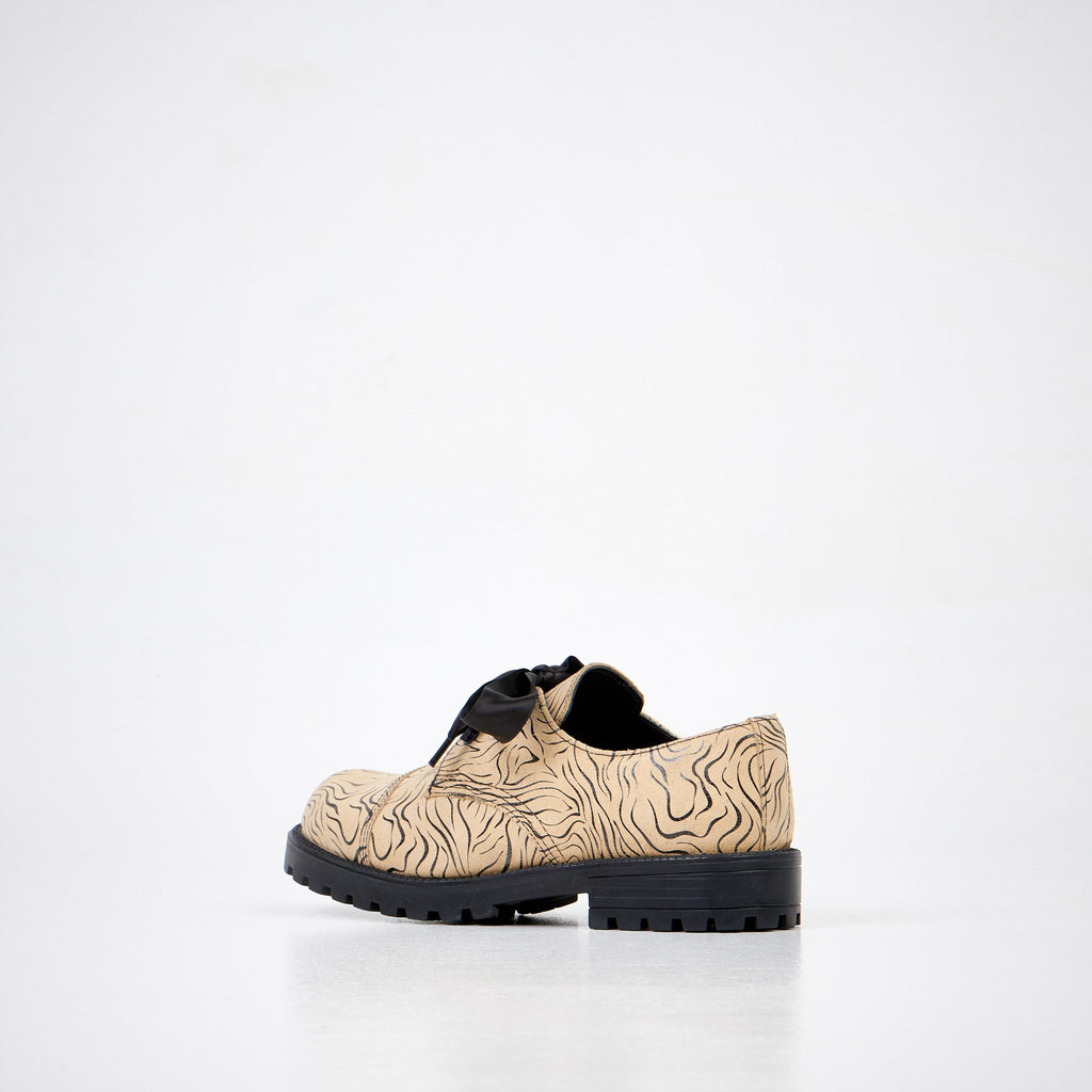 2. Unisex Samelin Beige Zebra Widgets showing side and back view, studio shot