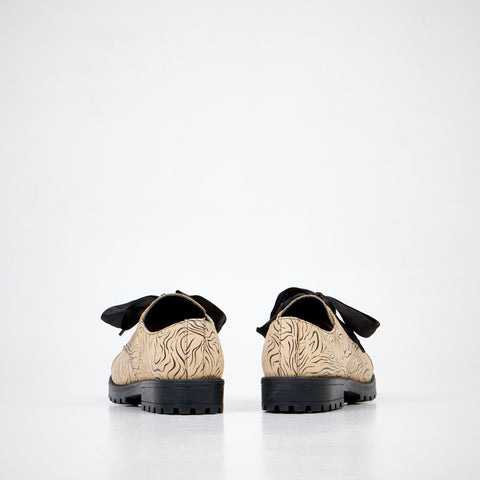 4. Back view of unisex Samelin Beige Zebra Widgets, highlighting zebra pattern and PU outsole
