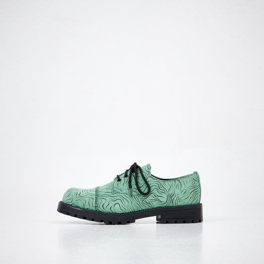 1. Unisex Samelin Green Zebra Widgets in genuine leather, side view in studio setting