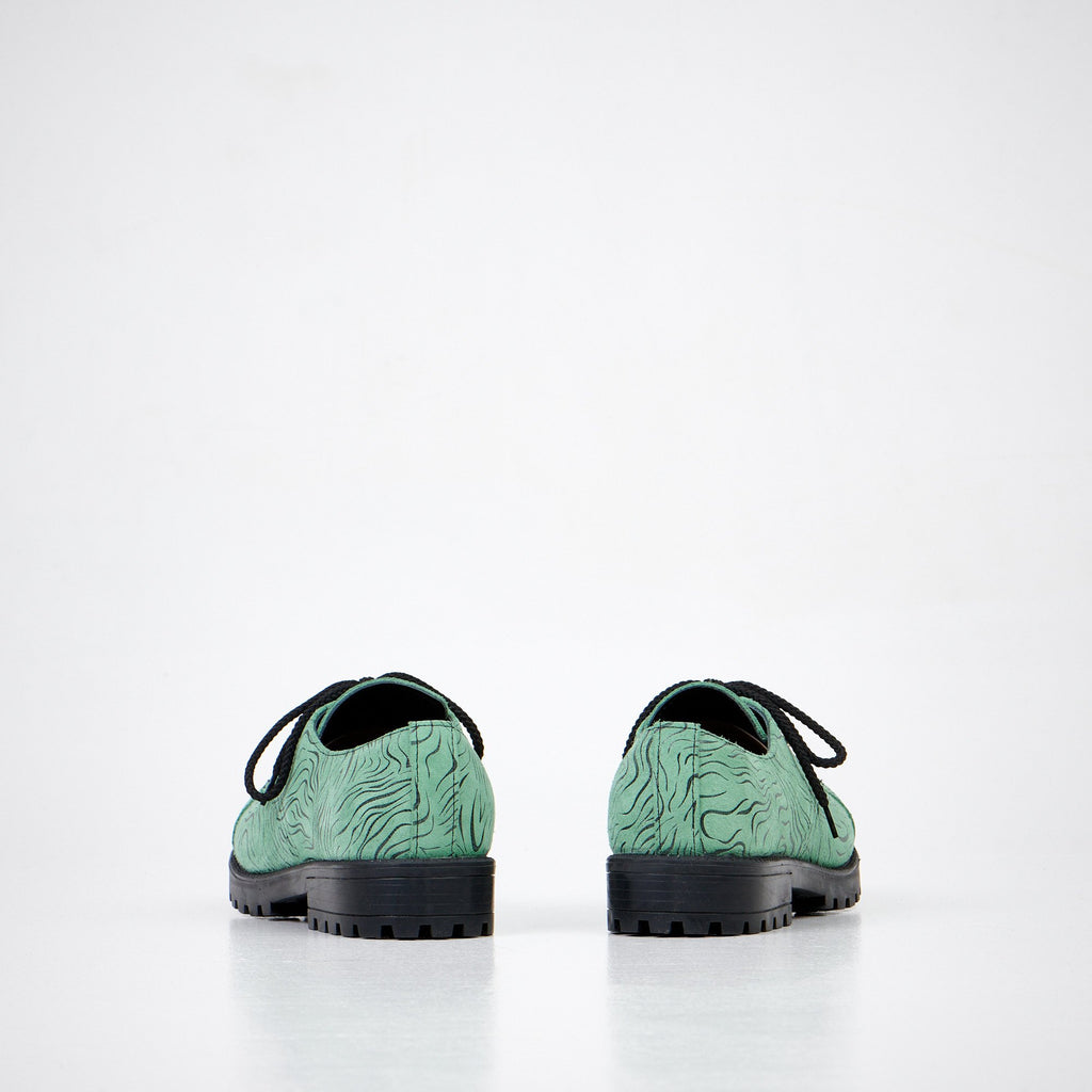 4. Back view of unisex Samelin Green Zebra Widgets, showcasing sole and pattern