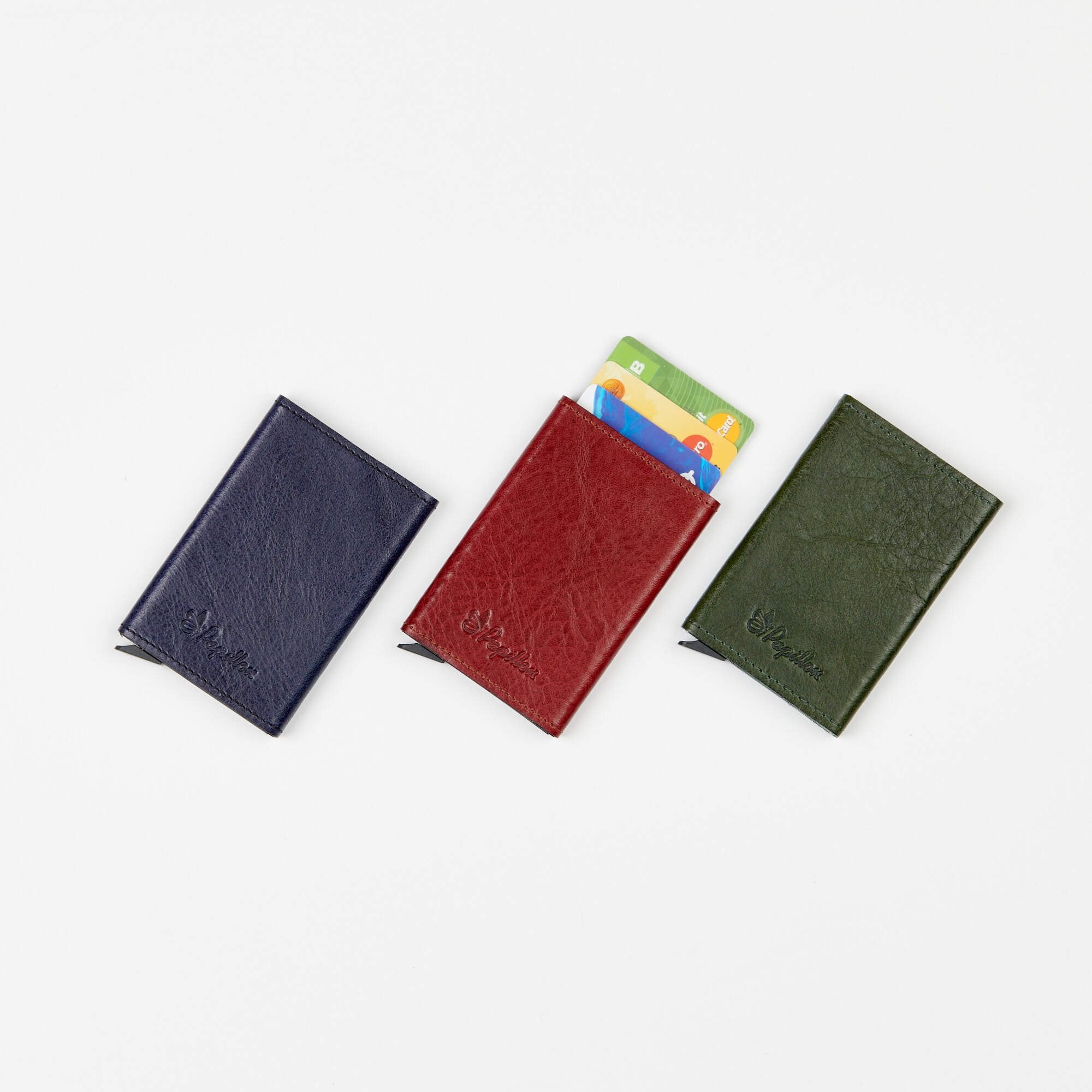 4. Papillon Card Holder No. 40 in blue, red, and green leather with cards visible, emphasizing color variety