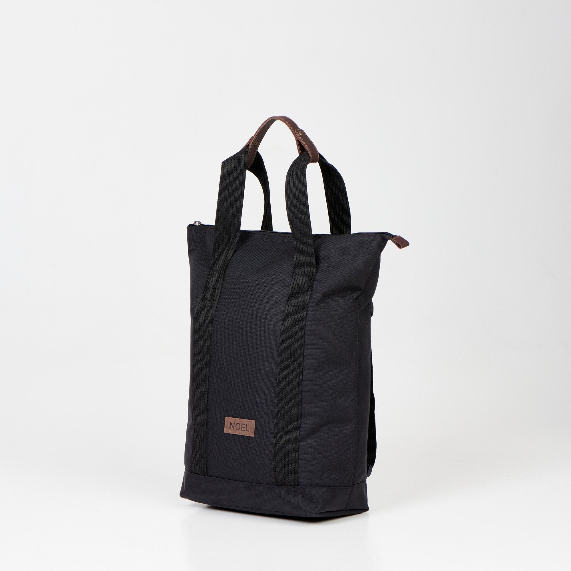 2. Black Noel 3in1 bag displayed as a shoulder bag with handles in studio