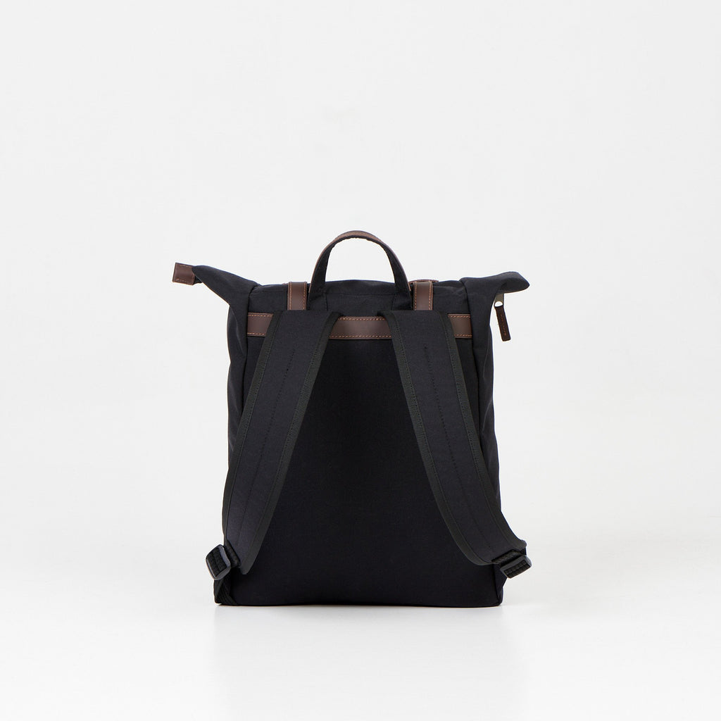 4. Back view of Noel black zip backpack highlighting padded shoulder straps