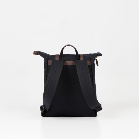 4. Back view of Noel black zip backpack highlighting padded shoulder straps