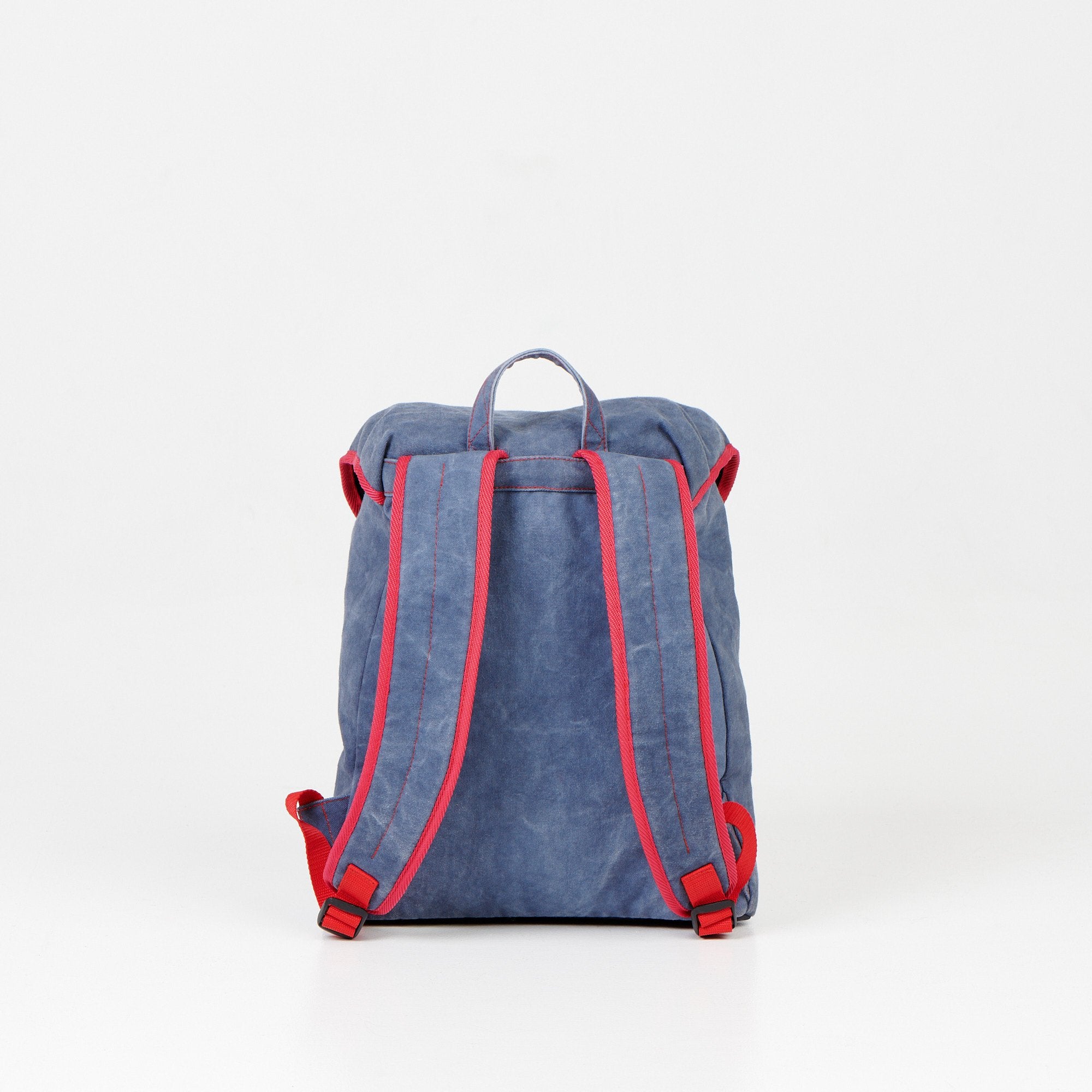 2. Back view of Noel Walker 12L backpack showing padded adjustable shoulder straps in studio