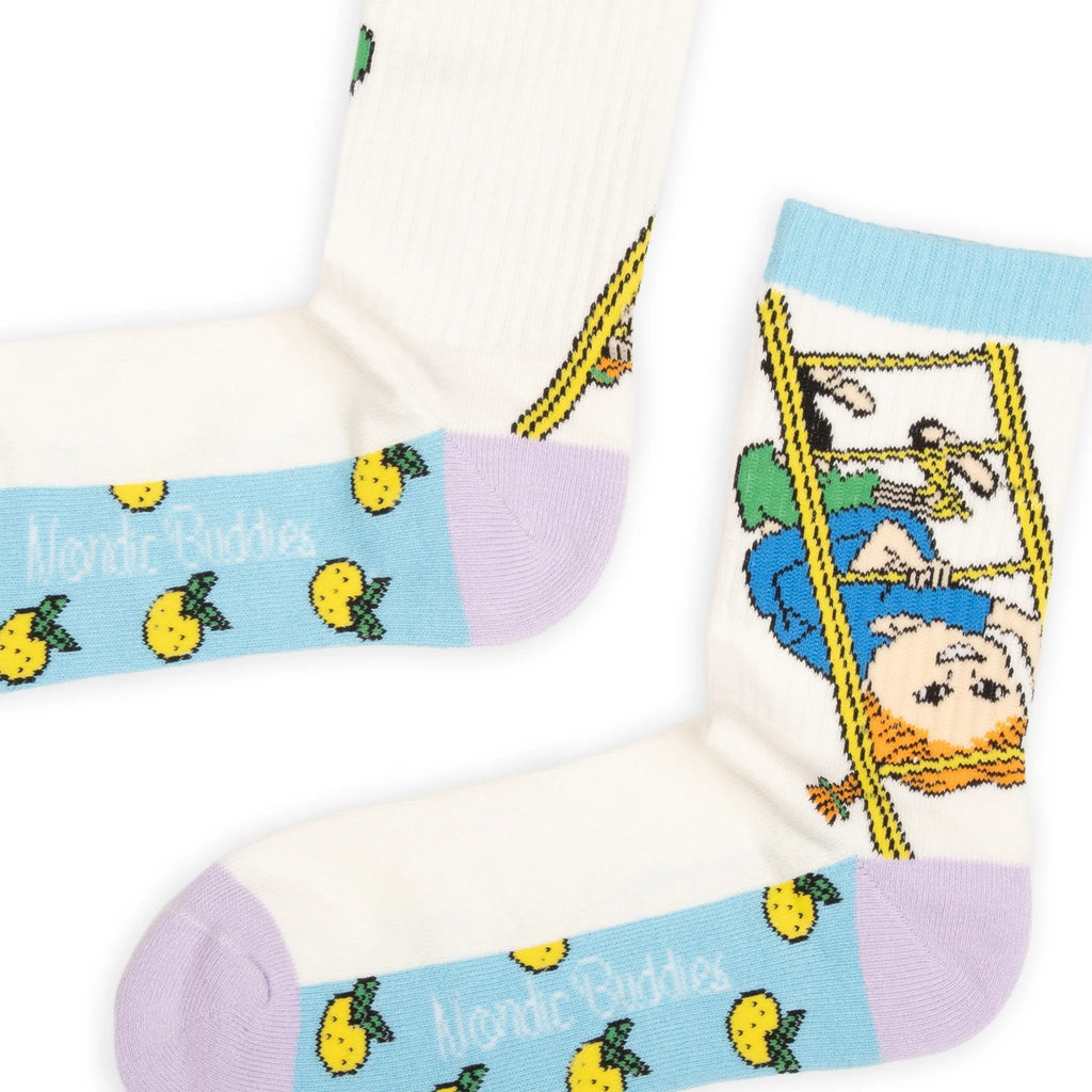 3. Close-up of multicolor Pippi Longstocking socks with cartoon design, highlighting blue, purple, and yellow accents and NordicBuddies logo