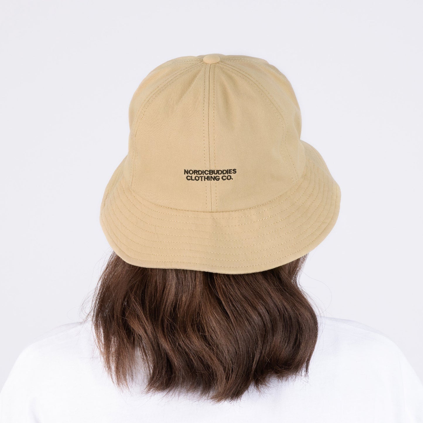 4. Woman wearing Pippi Longstocking beige bucket hat by NordicBuddies, shown from the back