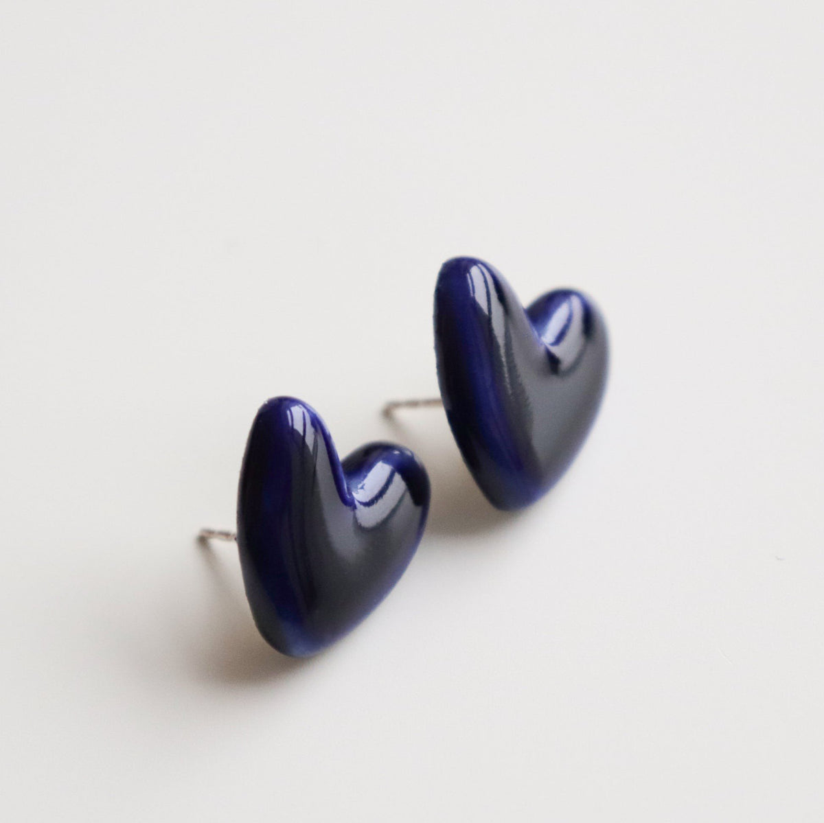 4. Rozenthal blue porcelain heart earrings with sterling silver posts, shown in studio