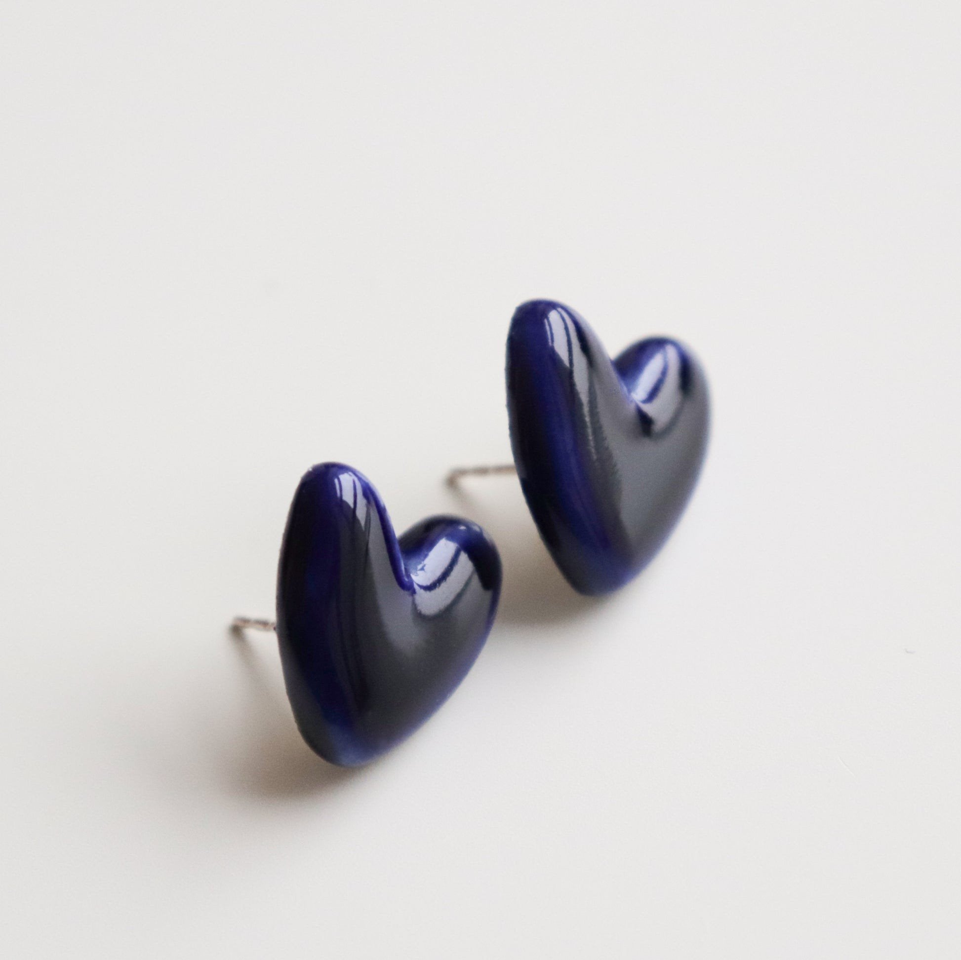 4. Rozenthal blue porcelain heart earrings with sterling silver posts, shown in studio