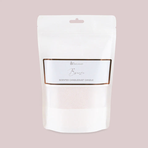 2. Candledust Breeze scented candle refill kit in white packaging with label on light pink background