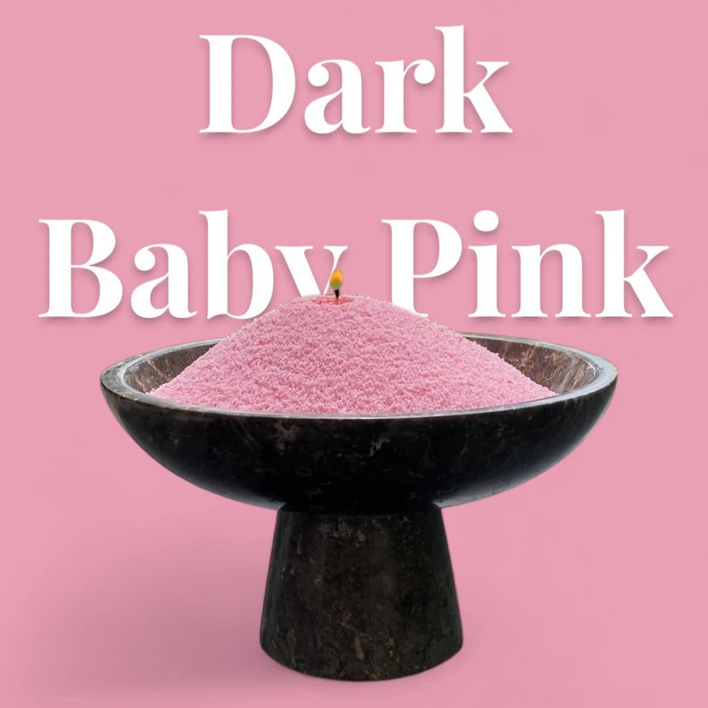 1. Dark baby pink powdered candle in black bowl with lit wick, text overlay