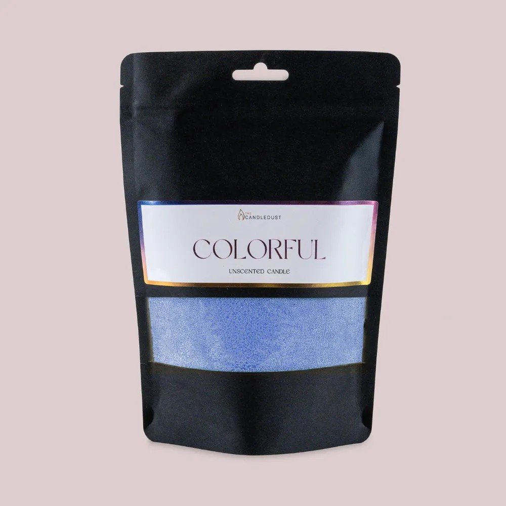 2. Candledust powdered candle refill kit in unscented dark blue, packaged in a black pouch with colorful label, on a light background