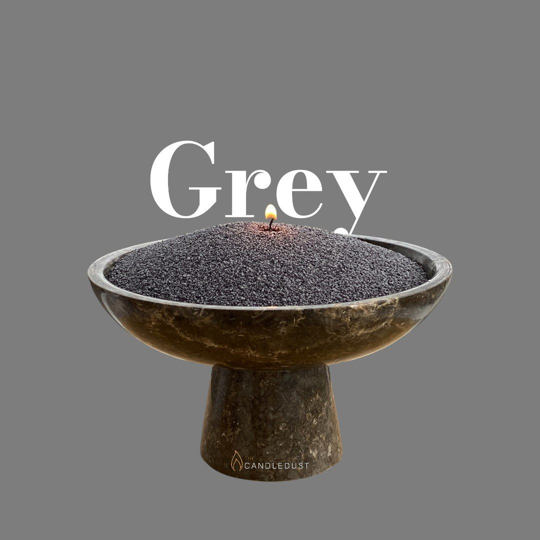 1. Grey powdered candle in a decorative bowl with a lit wick on a grey background with 'Grey' text