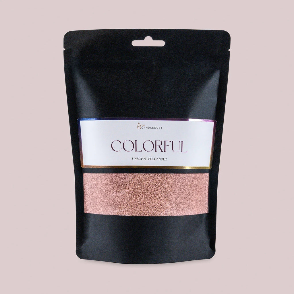 1. Black pouch of Candledust unscented candle sand in mocha mousse color with colorful label on light pink background