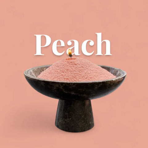 1. Unscented peach candle sand in black bowl with lit wick, peach background and text