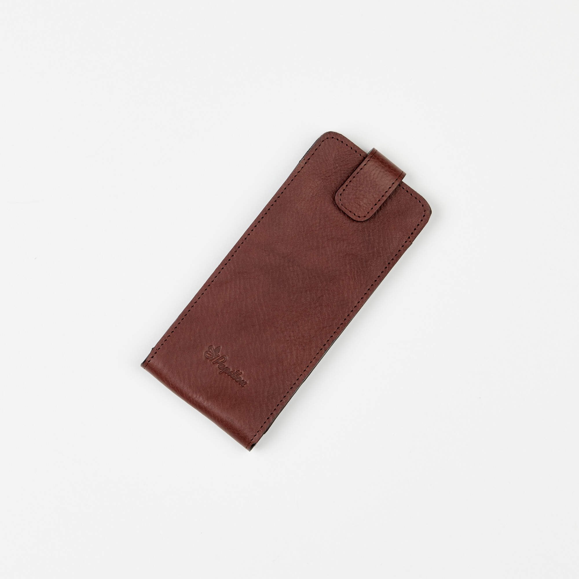 2. Studio shot of Papillon leather glasses case in brown, featuring embossed logo and secure closure
