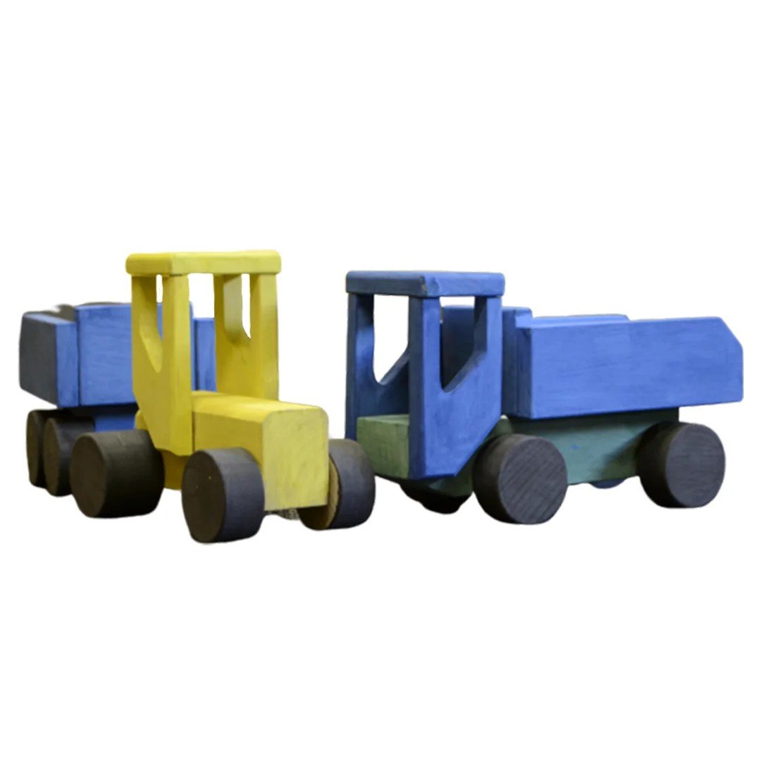 3. Close-up of two wooden toy tractors, one painted yellow and the other blue, with black wheels, showcasing the DIY assembly and painting feature