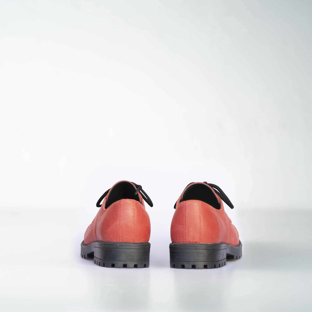 3. Back view of unisex red leather sneakers by Samelin, highlighting sturdy construction and black laces