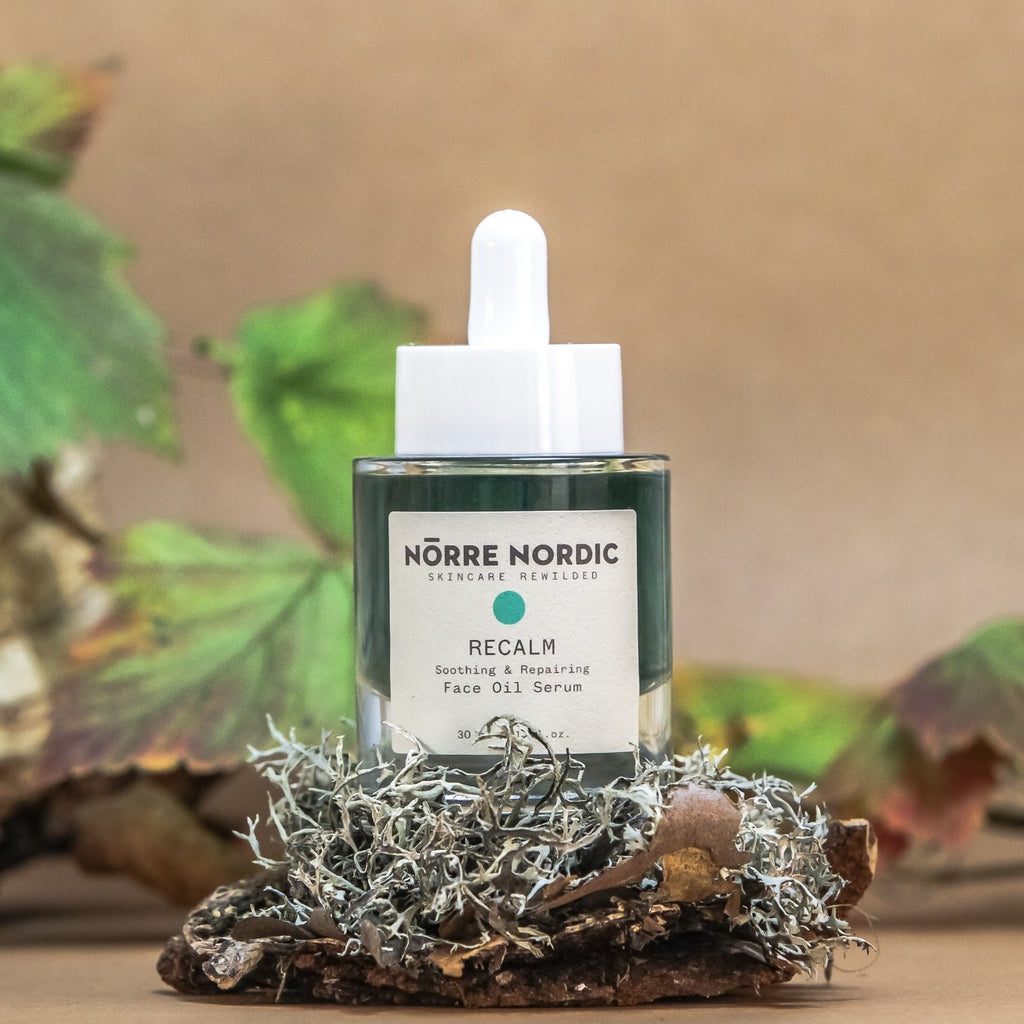 2. Nörre Nordic RECALM Soothing & Repairing Face Oil Serum bottle in natural setting