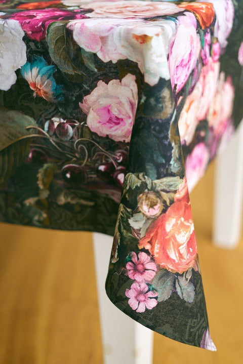 2. Close-up of Francine Black tablecloth corner showing detailed floral print on dark cotton fabric