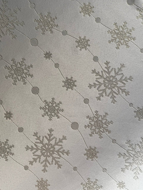 3. Detailed view of golden snowflake motif on polyester tablecloth