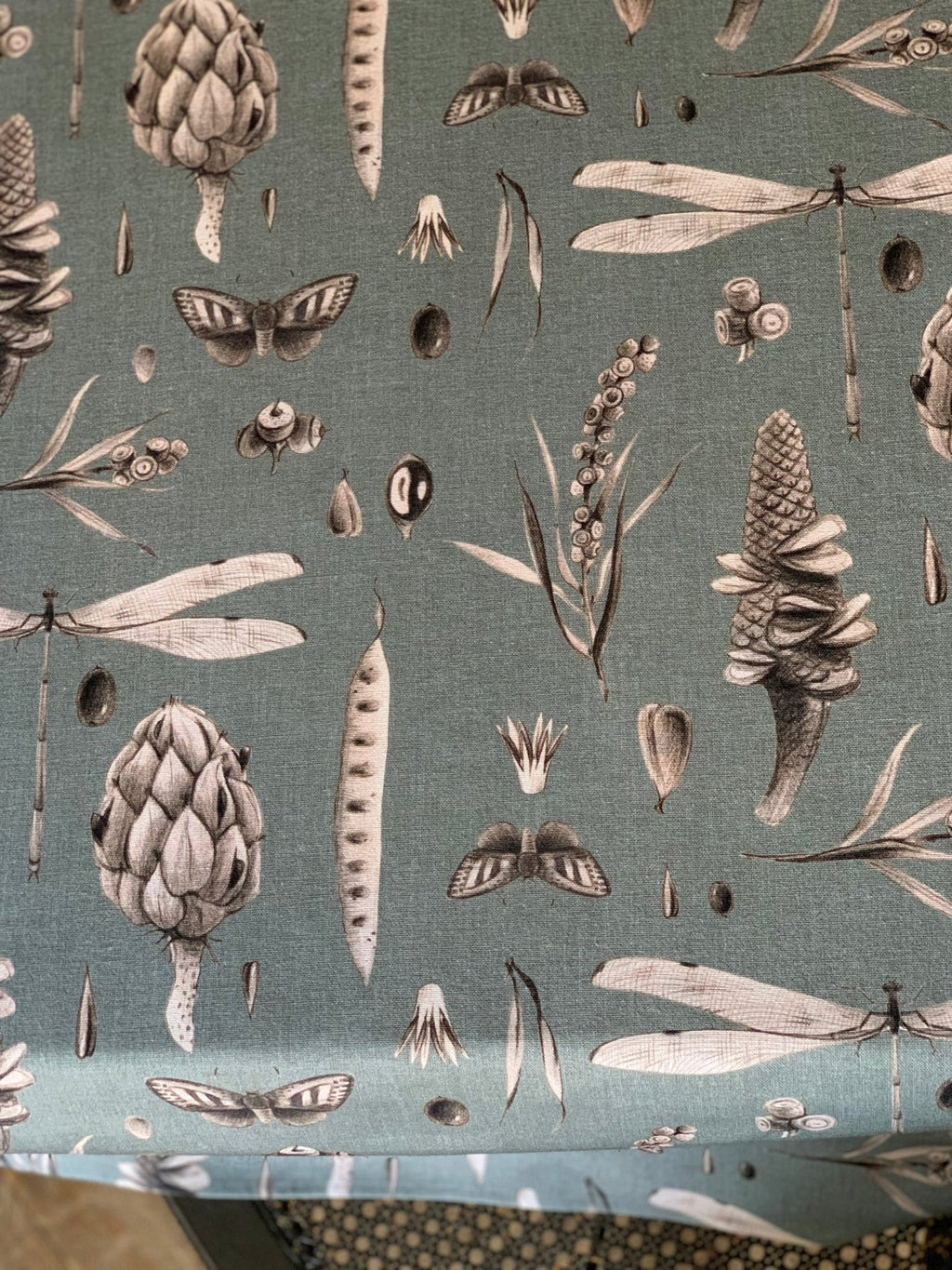 4. Detailed view of aqua tablecloth showcasing intricate botanical and insect patterns
