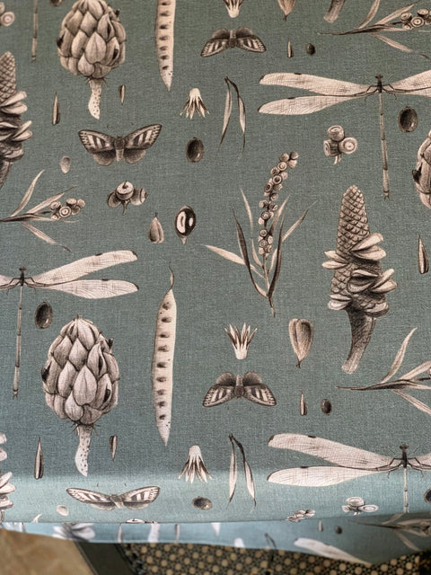 4. Detailed view of aqua tablecloth showcasing intricate botanical and insect patterns