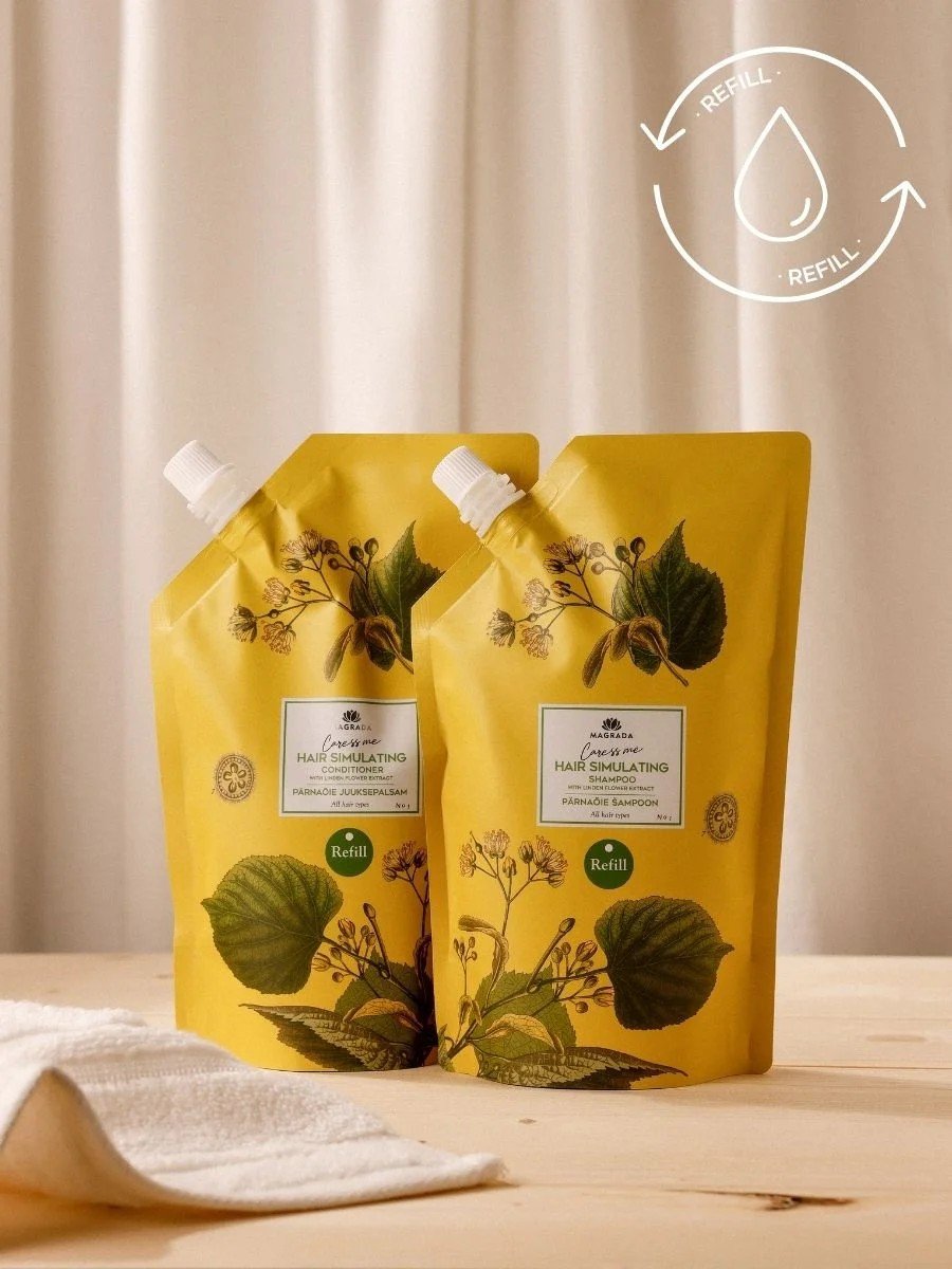 3. Two Magrada Organic Cosmetics linden flower conditioner refill packs on wooden table, emphasizing eco-friendly design