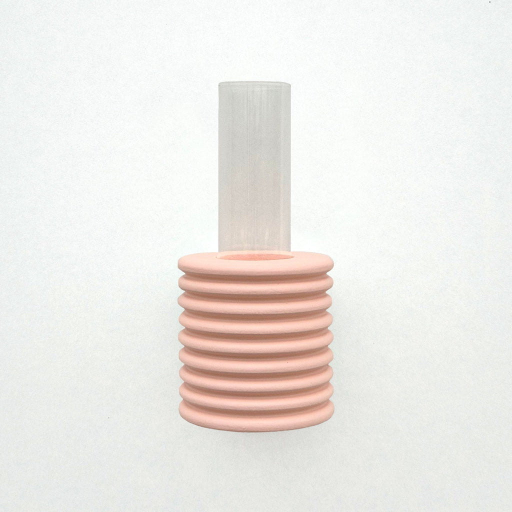 2. Studio shot of Ribble Wall Vase in pink by 5mm Paper, highlighting ribbed design and clear tube