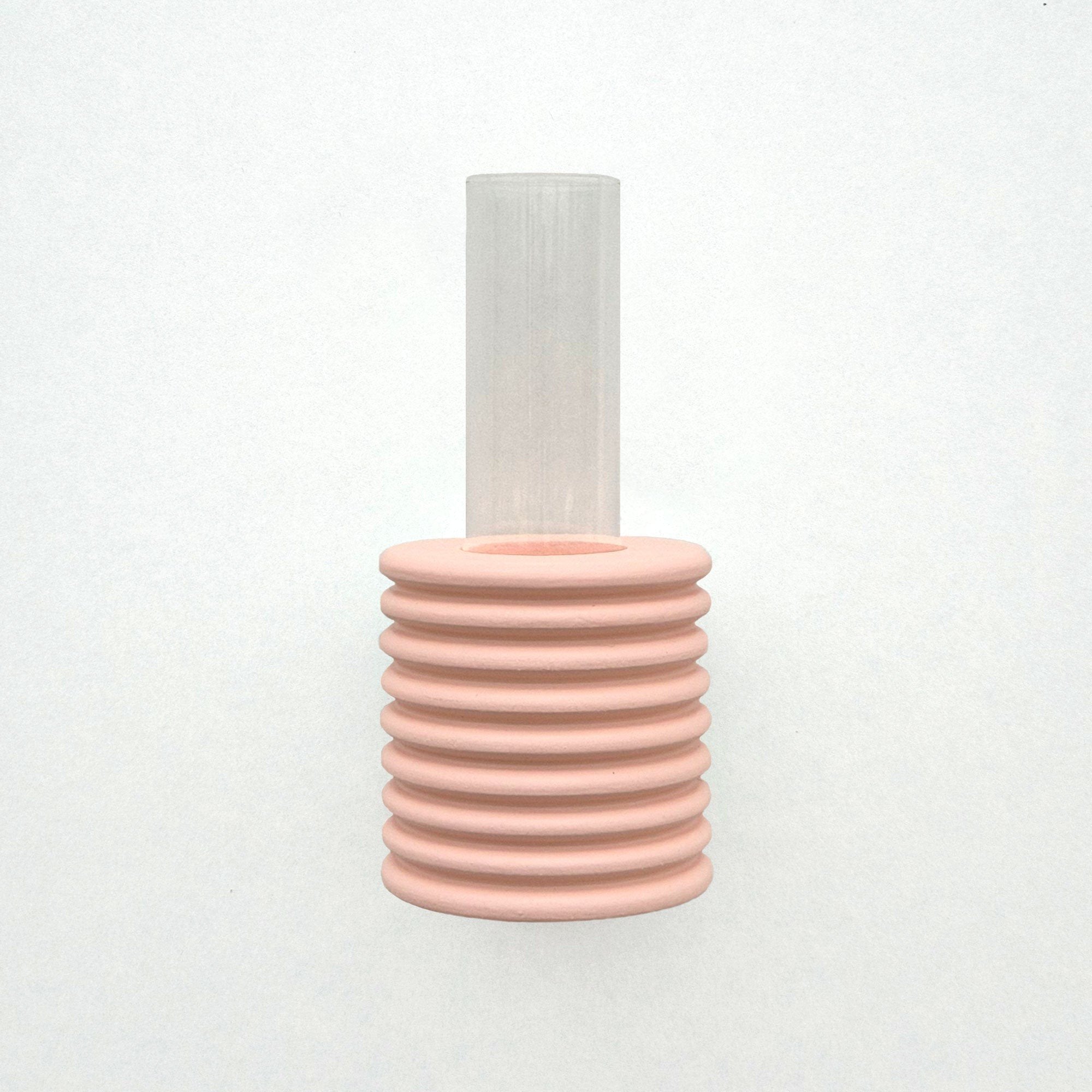 2. Studio shot of Ribble Wall Vase in pink by 5mm Paper, highlighting ribbed design and clear tube