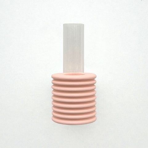 2. Studio shot of Ribble Wall Vase in pink by 5mm Paper, highlighting ribbed design and clear tube