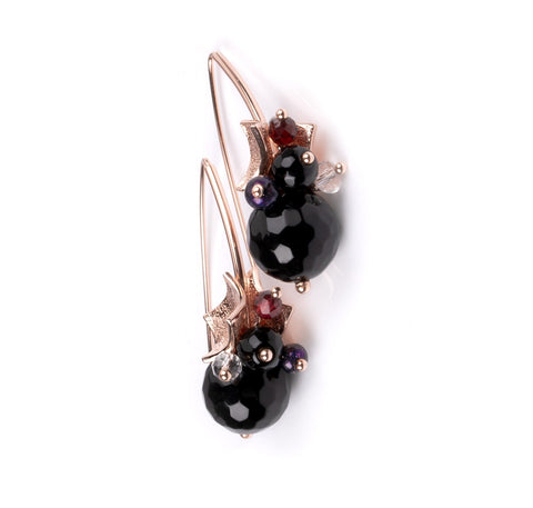 3. Close-up of MyaMoon Richie Black Earrings in rose gold with black onyx, red garnet, and rose quartz on white background