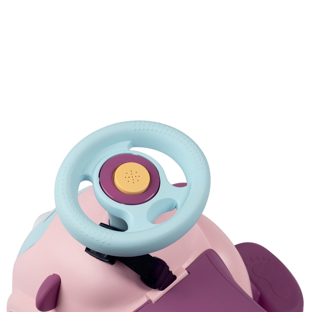12. Close-up of Smoby Ride-on Maestro 3in1 in pink, focusing on blue steering wheel with horn