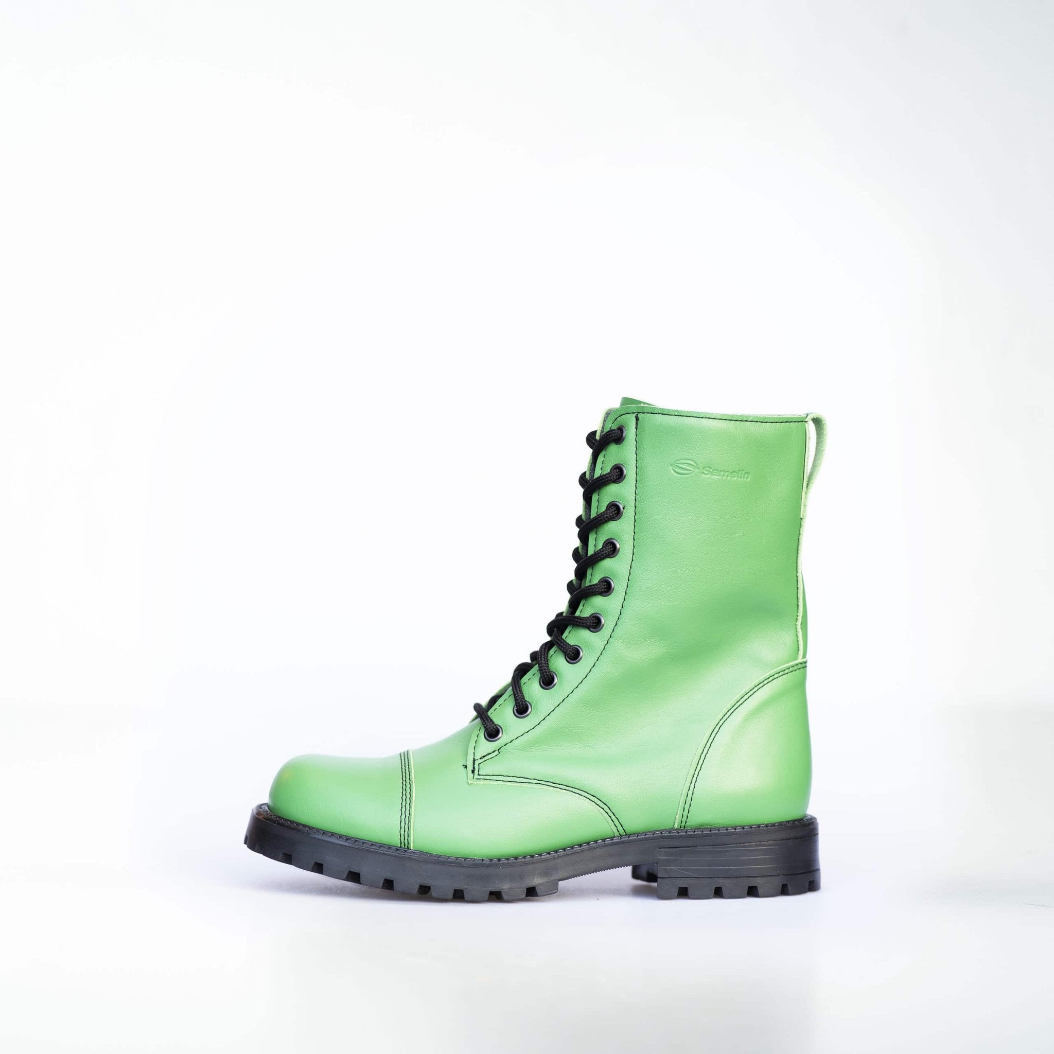 1. Unisex green Samelin 511 Granny Smith boots with zipper, side view in studio setting