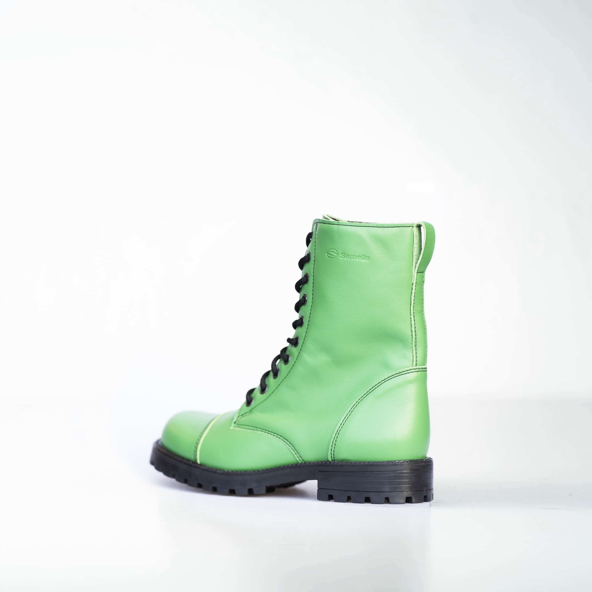 3. Unisex green Samelin 511 Granny Smith boots with zipper, side view showing logo in studio
