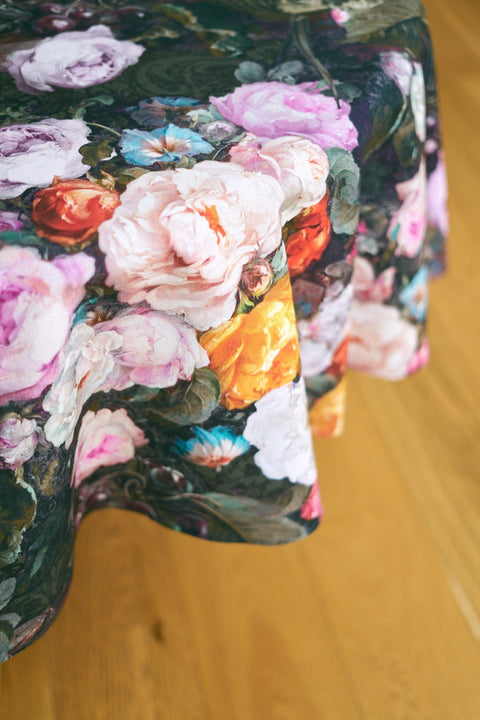 3. Close-up of Francine black floral tablecloth showing detailed pink, orange, and white flower print