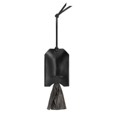 2. Studio shot of black leather Saku bag dispenser by Labbvenn with attached strap and visible bag, highlighting sleek design