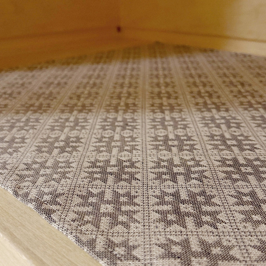 2. Close-up of sauna bench seating pad featuring Pärnu County mitten pattern on linen-cotton blend