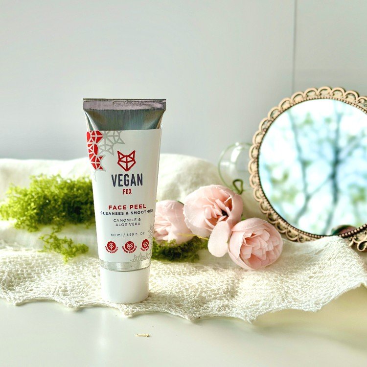 4. Vegan Fox Face Peel tube with a mirror and pink flowers, emphasizing its rejuvenating effects