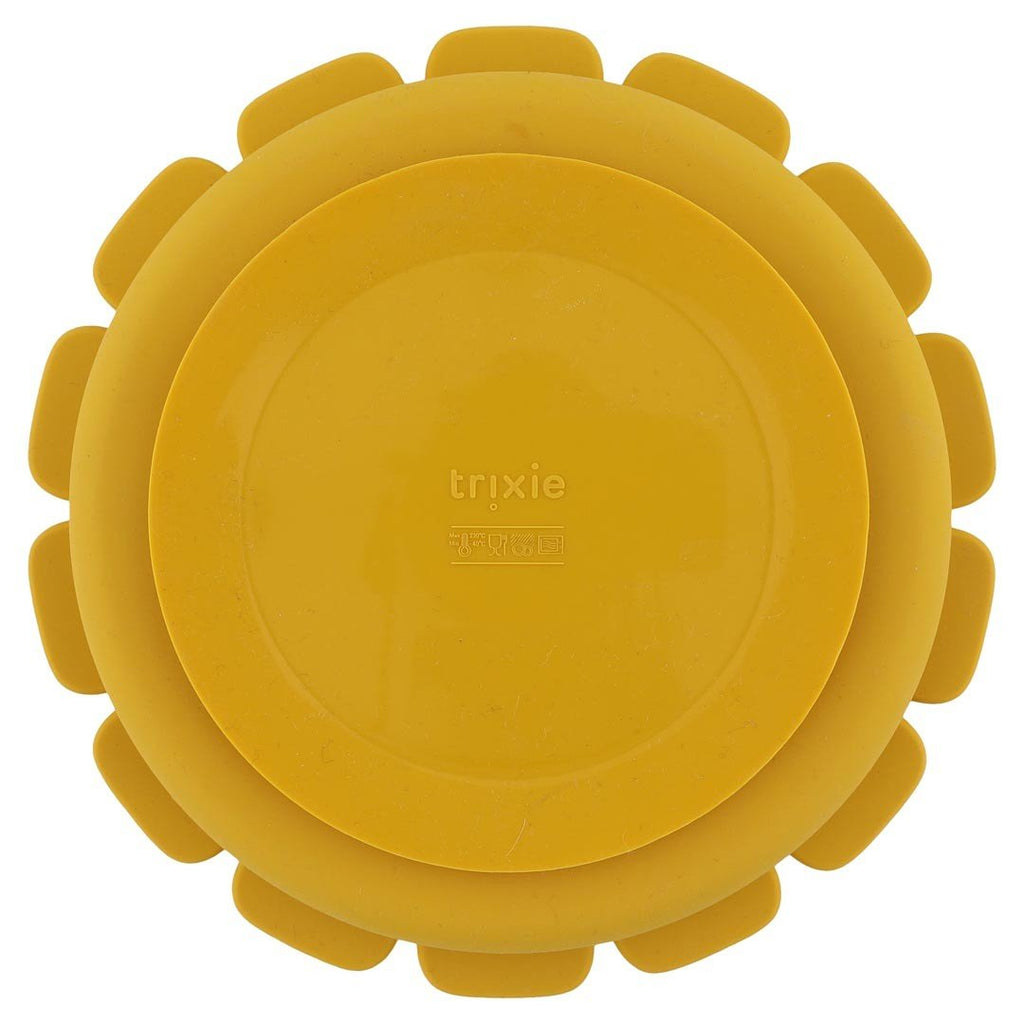 3. Back view of yellow lion-shaped silicone plate showing suction feature and Trixie logo