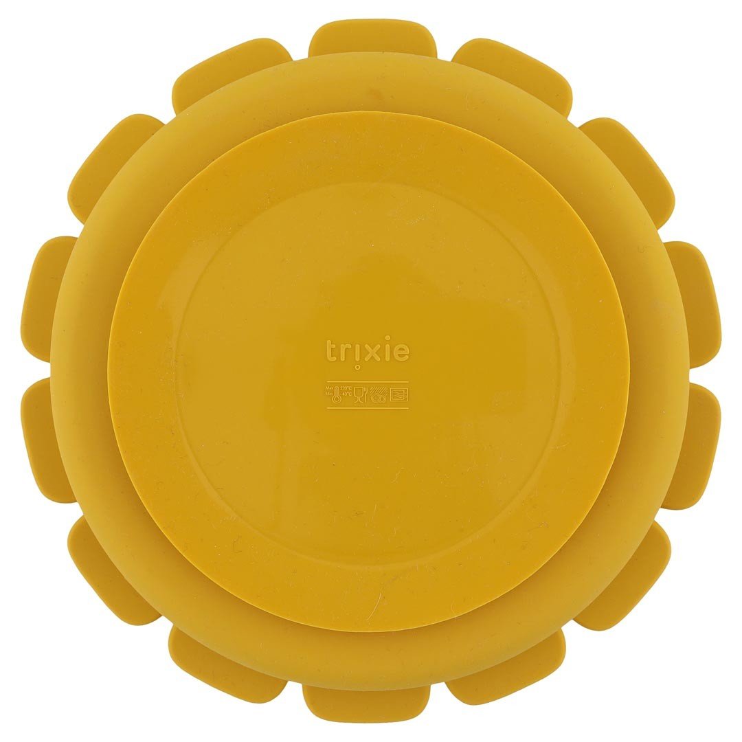 3. Back view of yellow lion-shaped silicone plate showing suction feature and Trixie logo