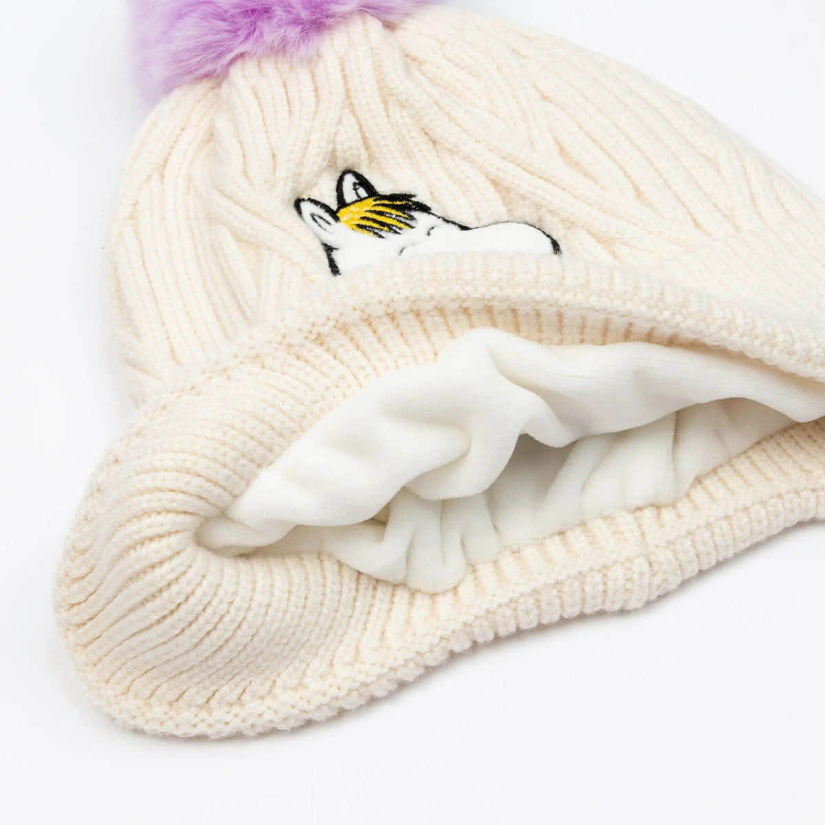 3. Close-up of cream Snorkmaiden beanie showing soft fleece lining and Moomin character embroidery