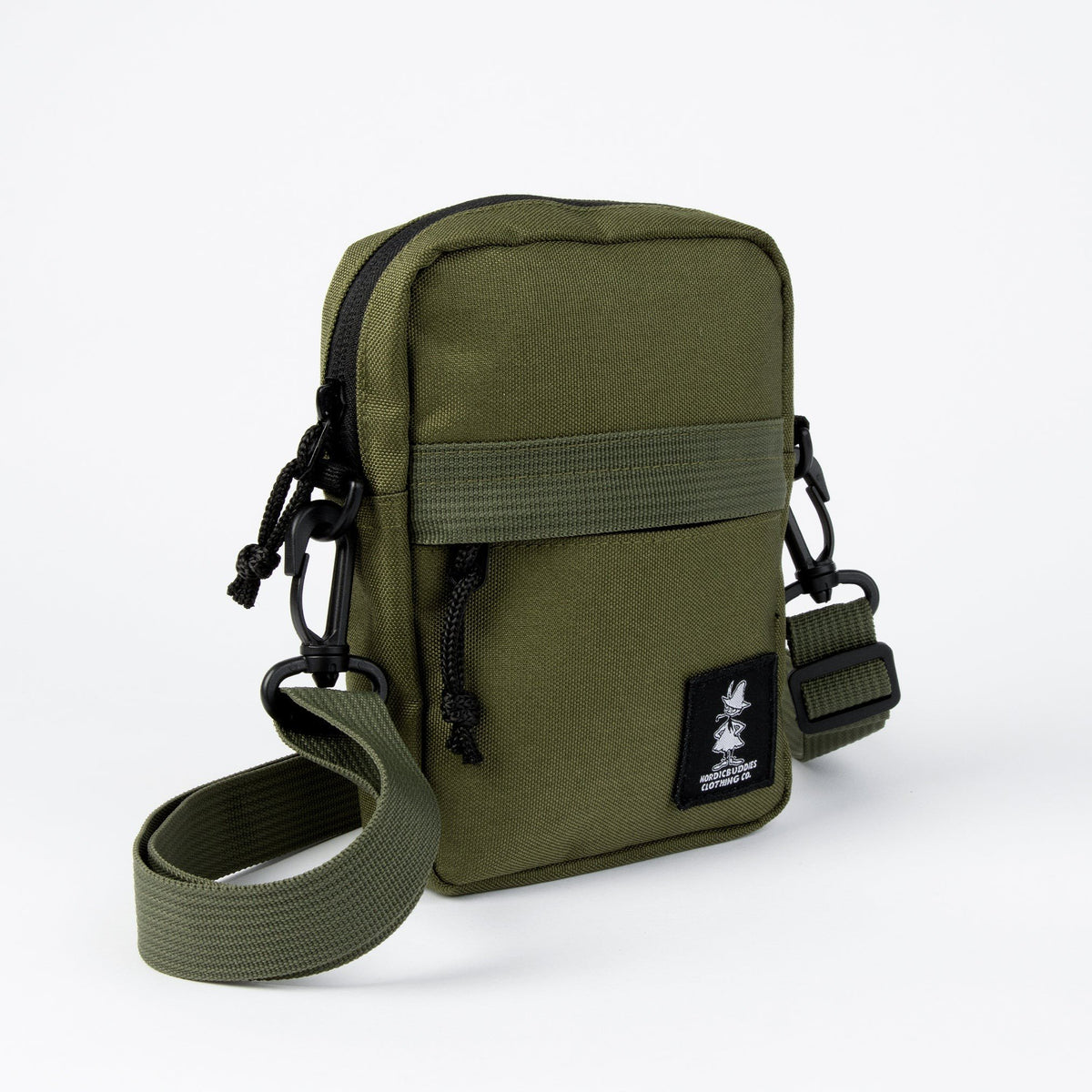 3. Side view of green Snufkin travel cross body bag by Moomin NordicBuddies with adjustable strap and black logo patch