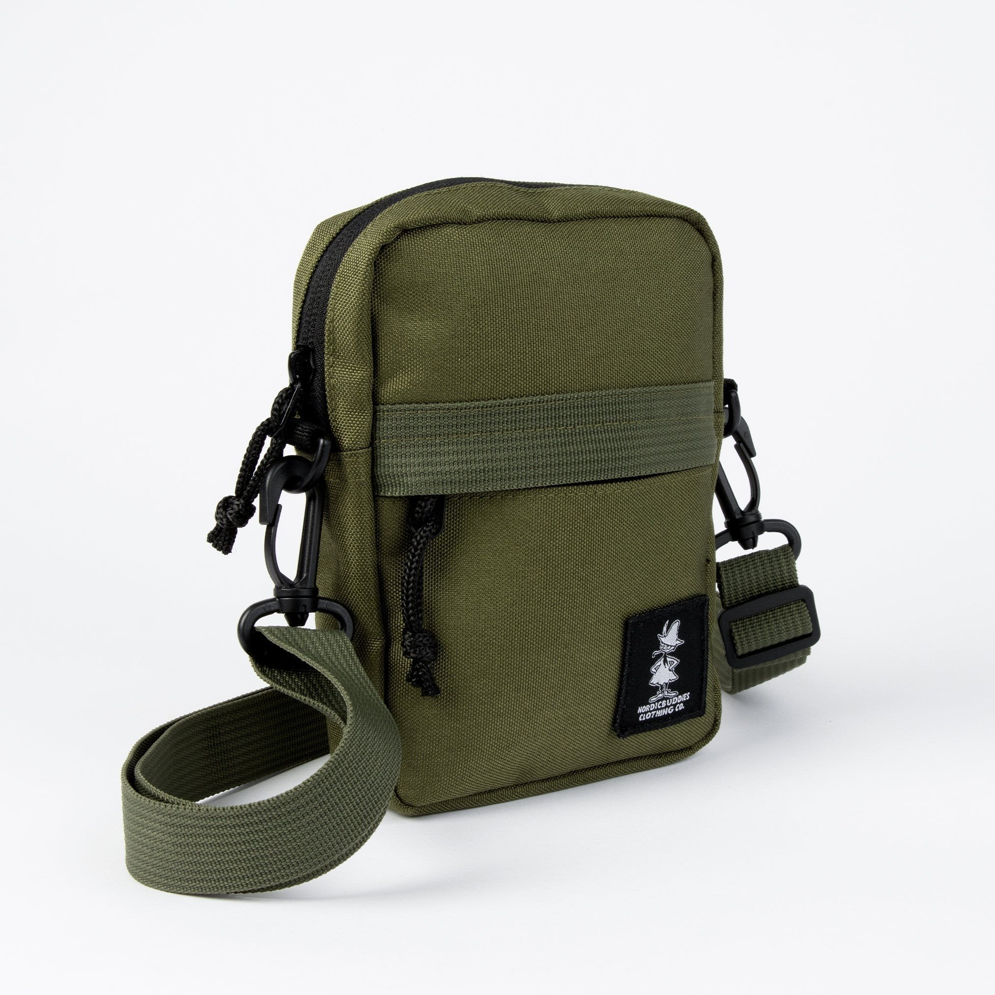 3. Side view of green Snufkin travel cross body bag by Moomin NordicBuddies with adjustable strap and black logo patch
