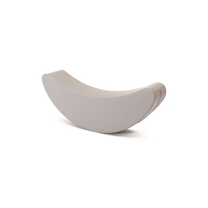 6. Studio shot of grey banana-shaped rocking toy on white background