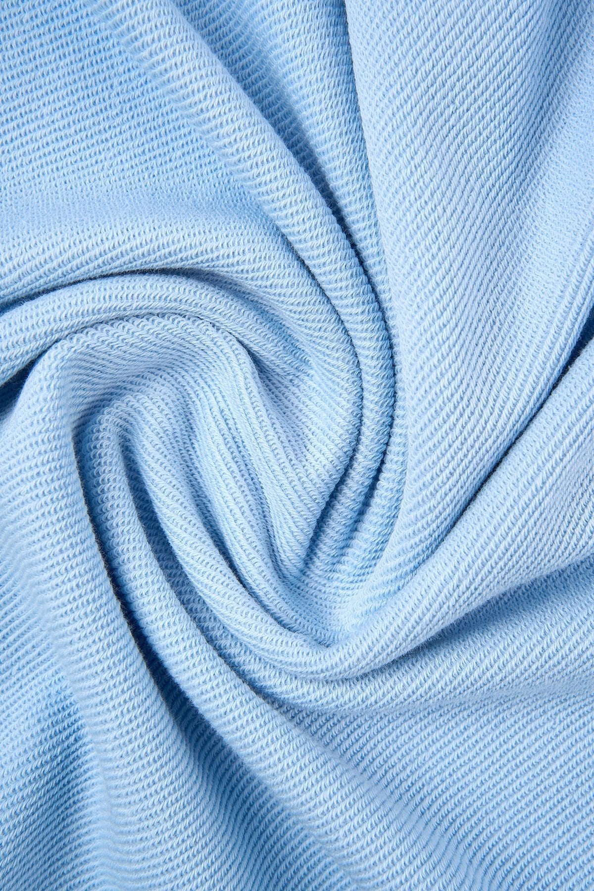 5. Close-up of light blue fleece fabric texture of Sossu sweatshirt
