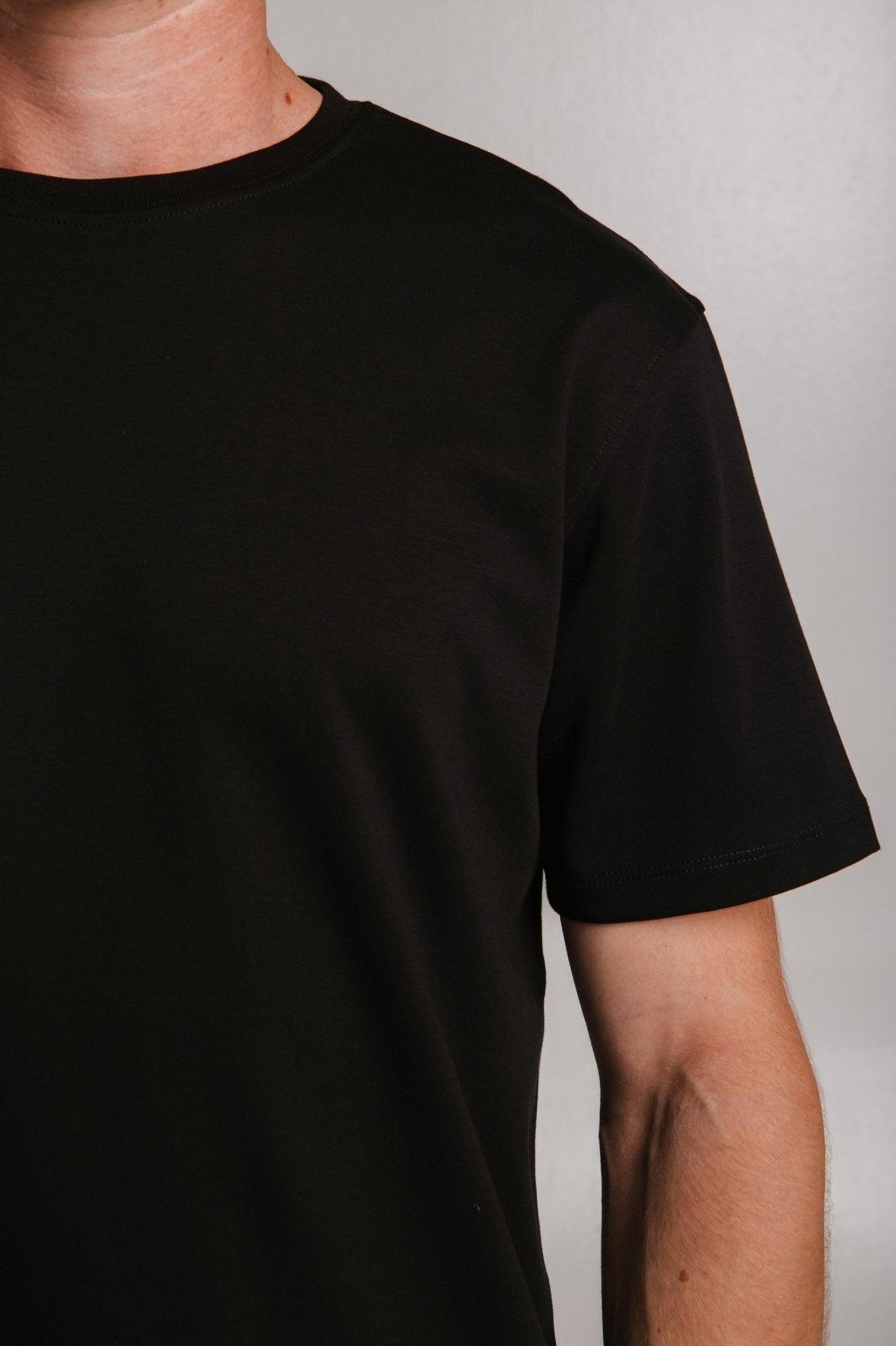 4. Close-up of Sossu black heavy t-shirt highlighting fabric texture