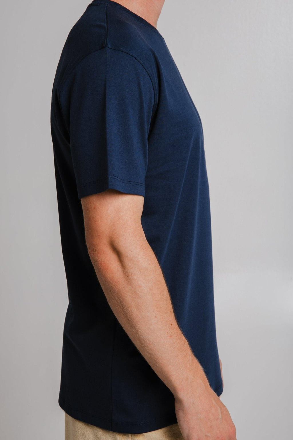 4. Side view of unisex navy blue heavy T-shirt by Sossu, highlighting fit and sleeve length