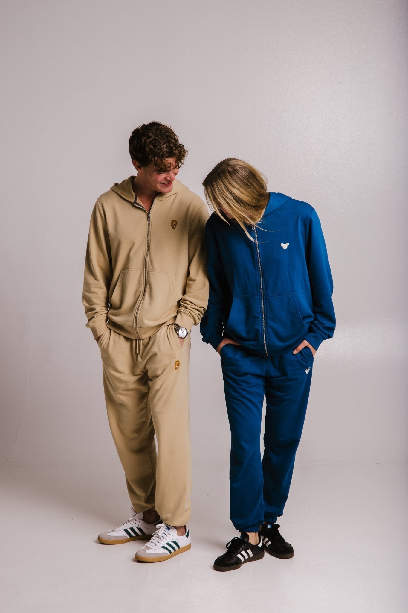 3. Unisex Lion Soft Fleece Full Zip Hoodie in light brown and blue, worn by male and female models standing, studio setting